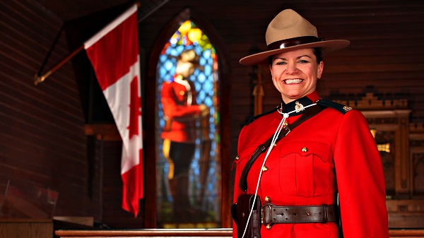 Constable Chantal Mitchell smiling in the Depot church for graduation