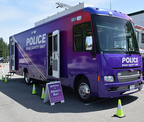 Alex's Bus with Police Road Safety Unit printed on the side and on the hood