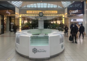 Photo of a City of Burnaby information kiosk inside Metrotown mall 