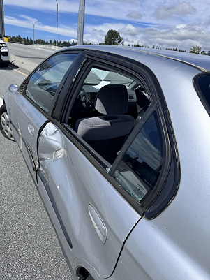 An up close picture of a Honda Civic which was side swiped on the Fern street overpass