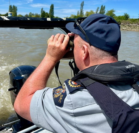 Staff Sergeant Major Ross Lundie on the Richmond RCMP boat The Fraser Guardian