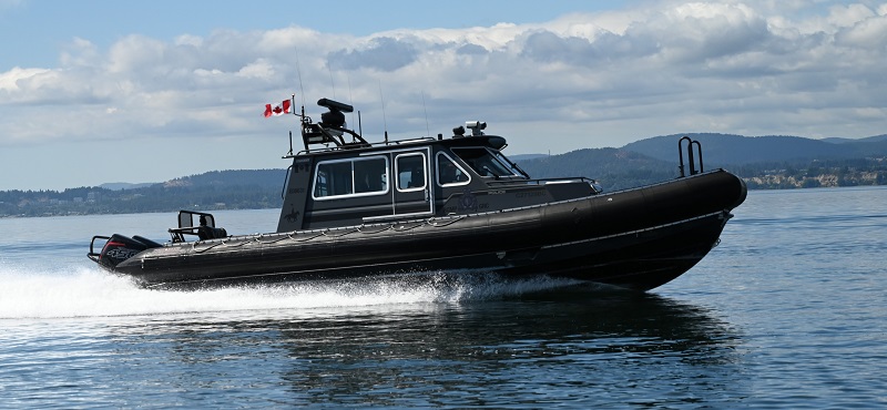 An RCMP vessel cruising on a body of water