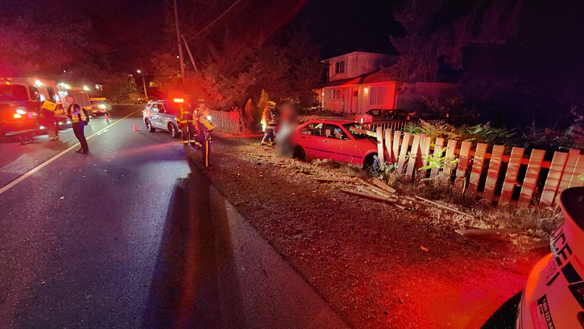 Photo of collision showing vehicle crashed into fence