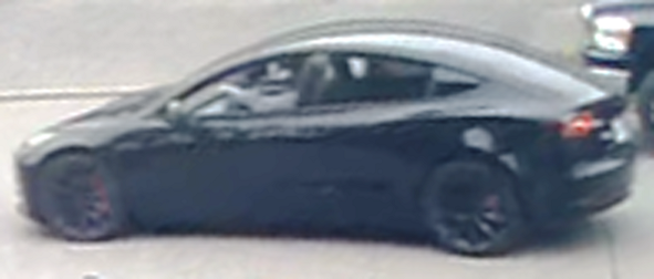 Picture of suspect vehicle, a black Tesla Model 3 with black rims and red break callipers 