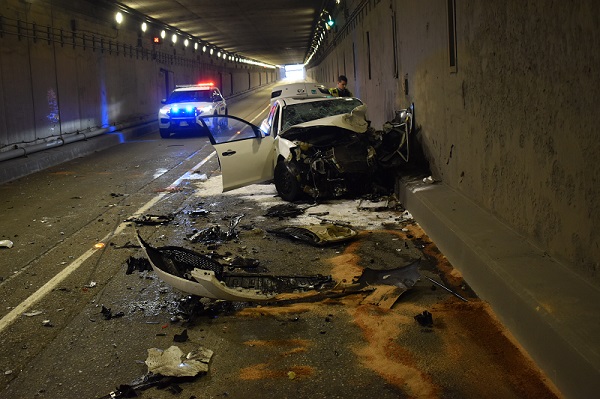 A collision between a white Toyota Sienna and a white Mazda 3 shut down traffic for over three hours.