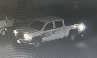 Four-door pick-up truck with flames on the driver’s side