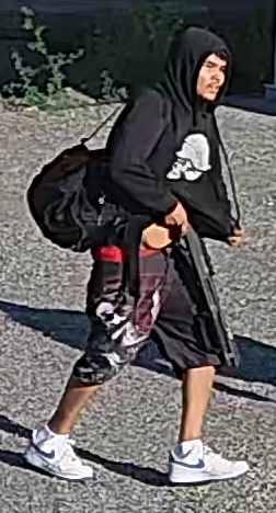 Photo of the second suspect wearing a black Metal Mulisha hoody and black shorts.