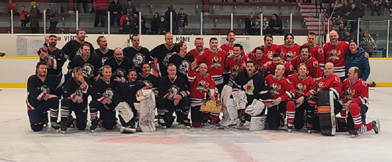 RCMP and Firefighters combined team photo on the ice