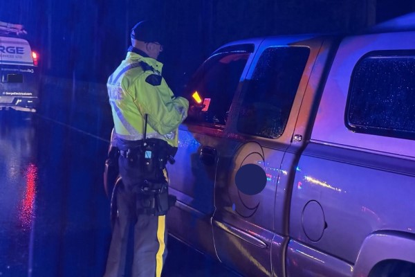 A BC Highway Patrol officer conducts an impaired driving checkstop