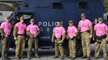 ERT members wearing pink shirts