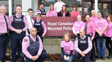 North Van RCMP wearing pink shirts