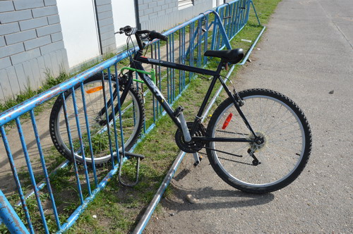 Image of a bicycle locked to a stand