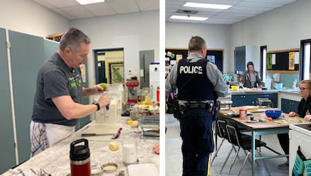 Cst. Bentley preparing a cooking demonstration in class and speaking in front of students in unform.