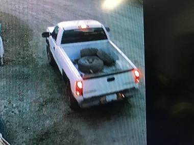 white pickup truck with tires in the box  