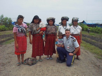 Photo of Inspector Maure with Guatemalan girls.