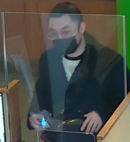 Suspect wearing a face mask