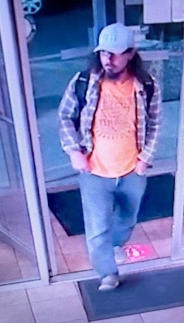 male suspect in orange shirt