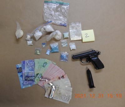 Photo of drugs, cash and firearm seized