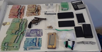Photo of drugs, gun and cash seizure