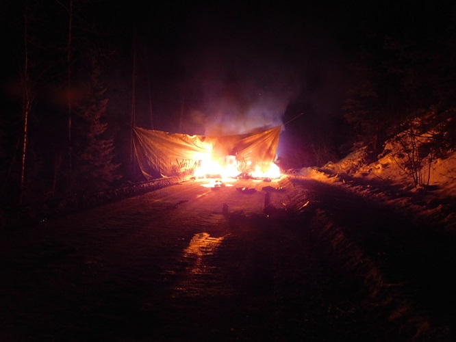 Photo 1 of tarp on fire