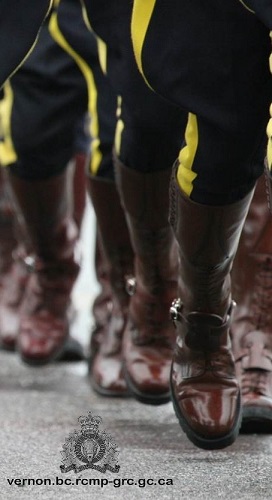 photo of rcmp officers marching in high brown boots