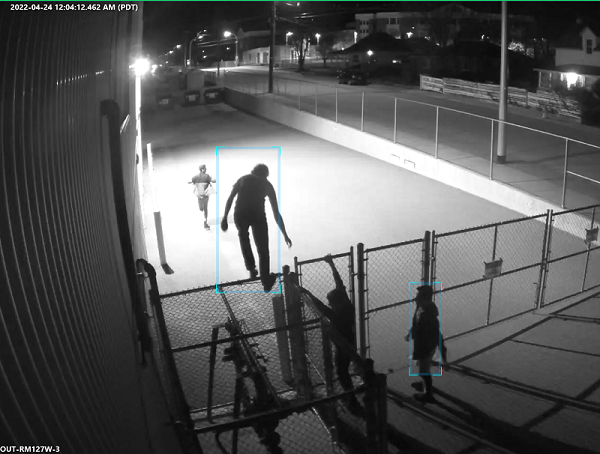 A photo of the group of people entering the school property. 