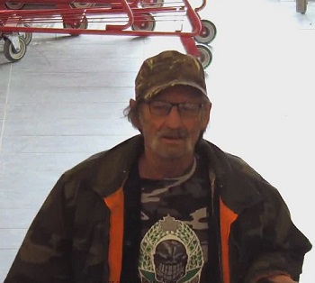 older male wearing a camo cap, glasses with a large mustache and a camo jacket
