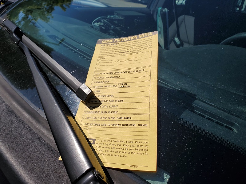 Photo of a Crime Prevention Notices on a vehicle’s windshield. 
