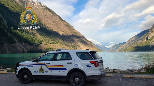 Photo of RCMP vehicle with view of Seton Lake, BC