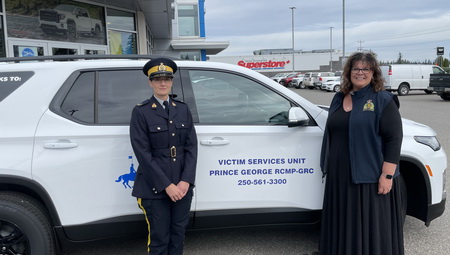 Photo of the new vehicle with Victim Services Co-ordinator Aralee Hryciuk and Cpl Cooper 