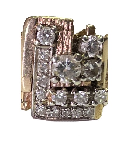Diamond encrusted top of a yellow gold ring