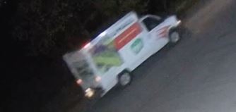 Surveillance video still of U-haul truck in colour