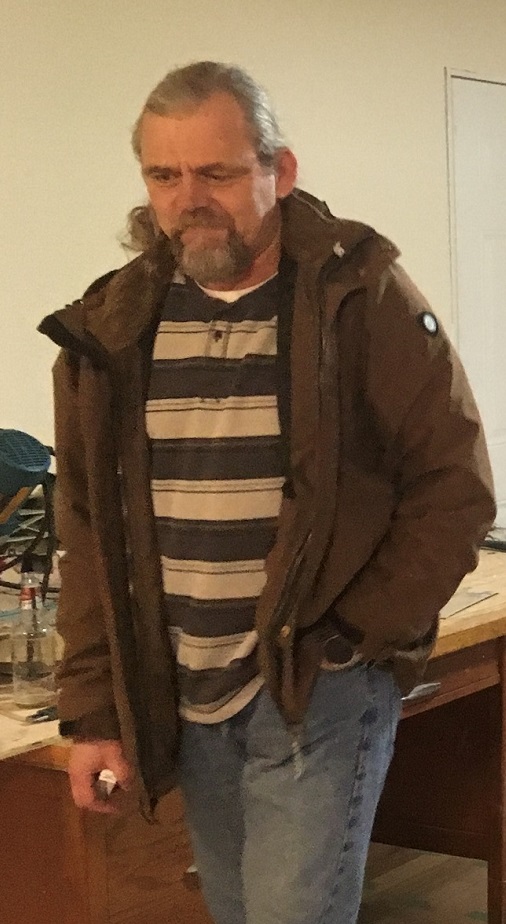 James Cheetham wearing brown jacket