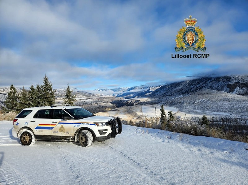 View of RCMP vehicle with mountains in background