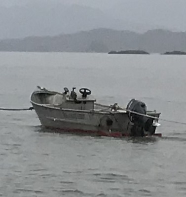 Photo of the stolen boat on the water from an angle