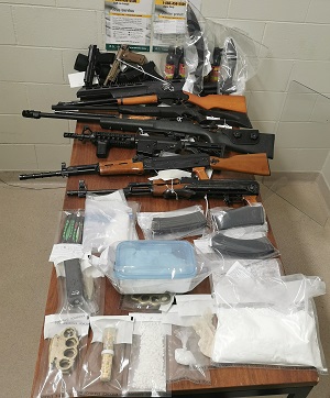 Guns and other weapons displayed on table