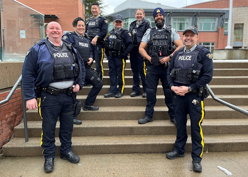 Seven Youth RCMP officers in uniform standing on stairs