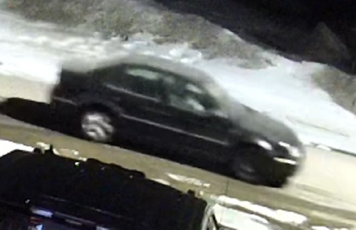 surveillance photo of the suspect vehicle, described as a black or dark mid-2000 Volkswagen Jetta 