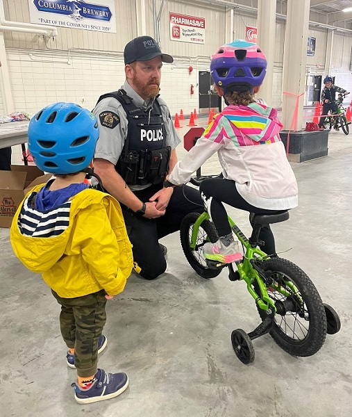 Cst. Kyle Konowalchuk assisting children