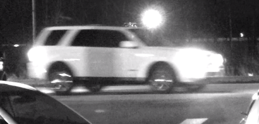 Video-still photo of suspect white vehicle driving