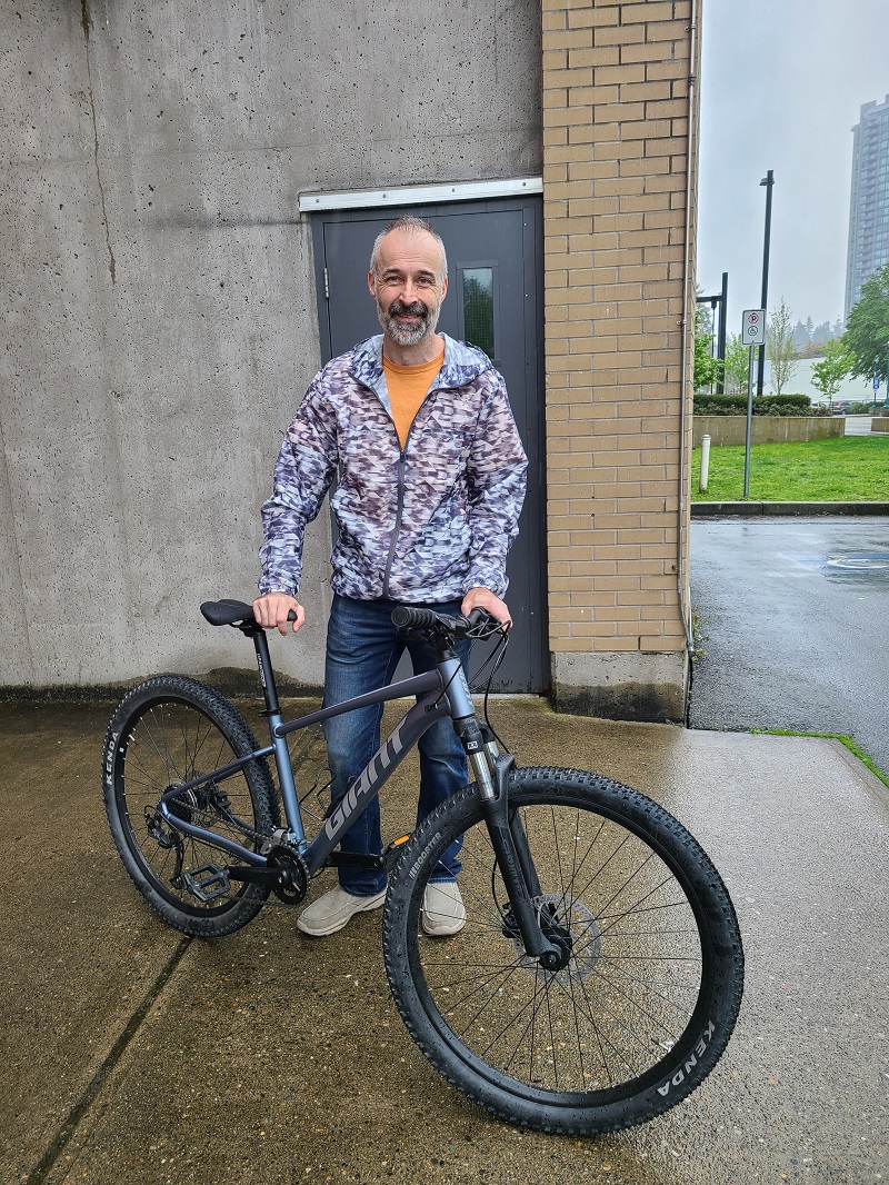 Owner, Mike Dockal reunited with returned stolen silver Giant Talon bicycle