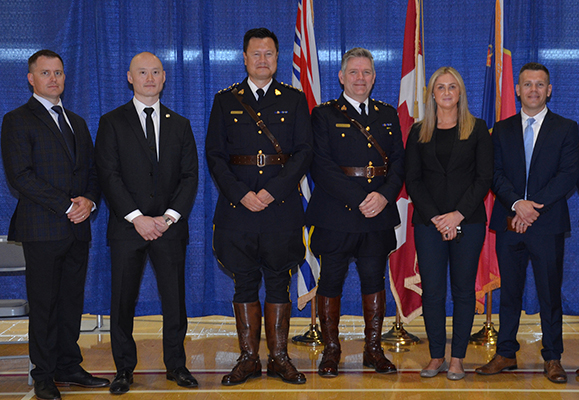 A group of newly hired experienced police officers standing together.