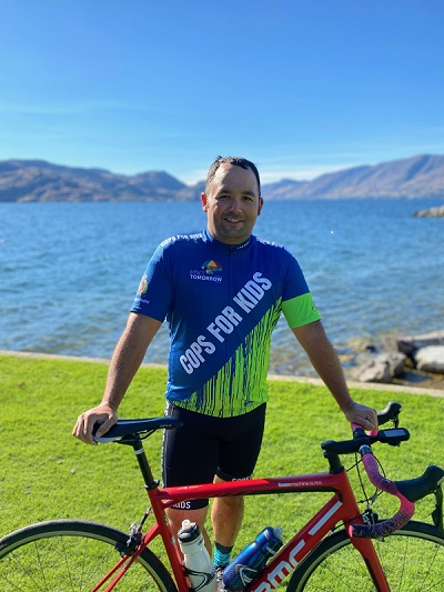 Cst. Brett Urano wit his bike by the lake