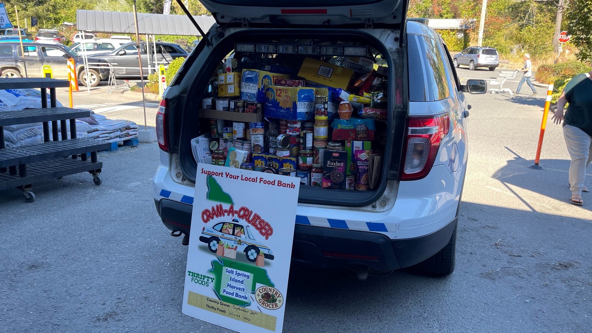 police vehicle filled with donated goods