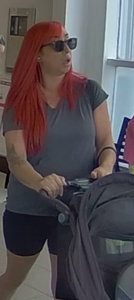 Suspect # 2 red hair, black shorts with baby stroller 