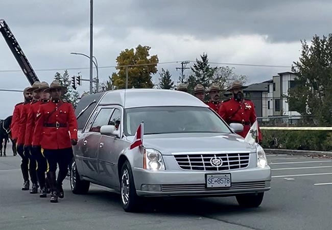 Funeral Coach and troop mates marching