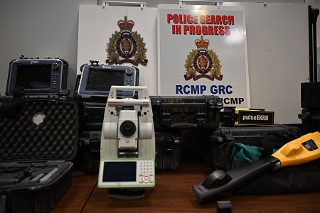 Heavy duty specialized surveying equipment laid out on a table.