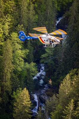 Photo of a helicopter used to hoist Emergency Response Team officers over a canyon during a training exercise